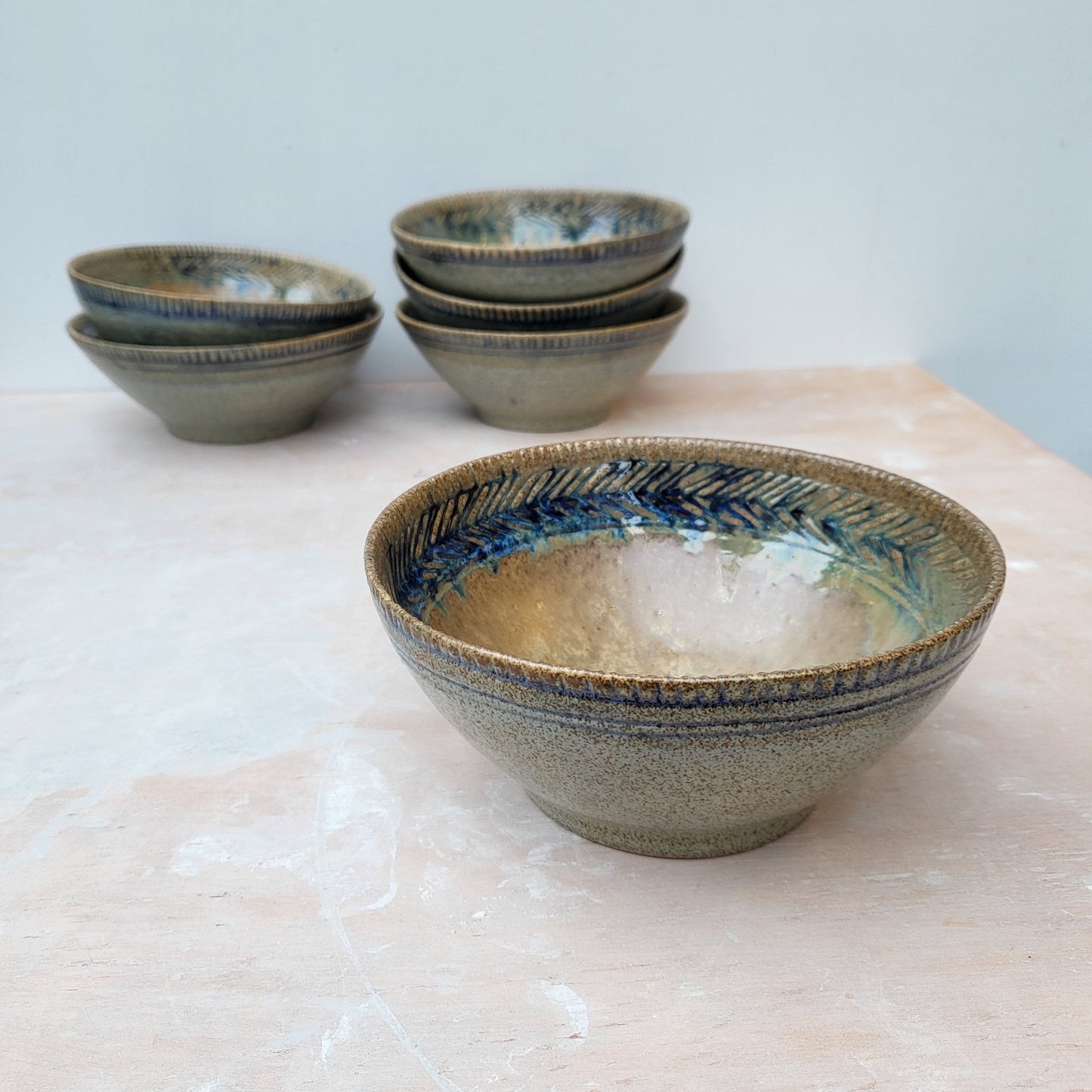Handmade ceramic bowl with blue carvings. Keramiek
