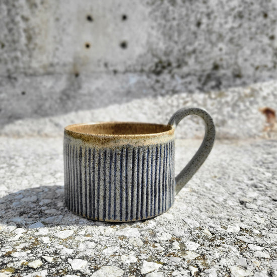 Cup with blue stripes