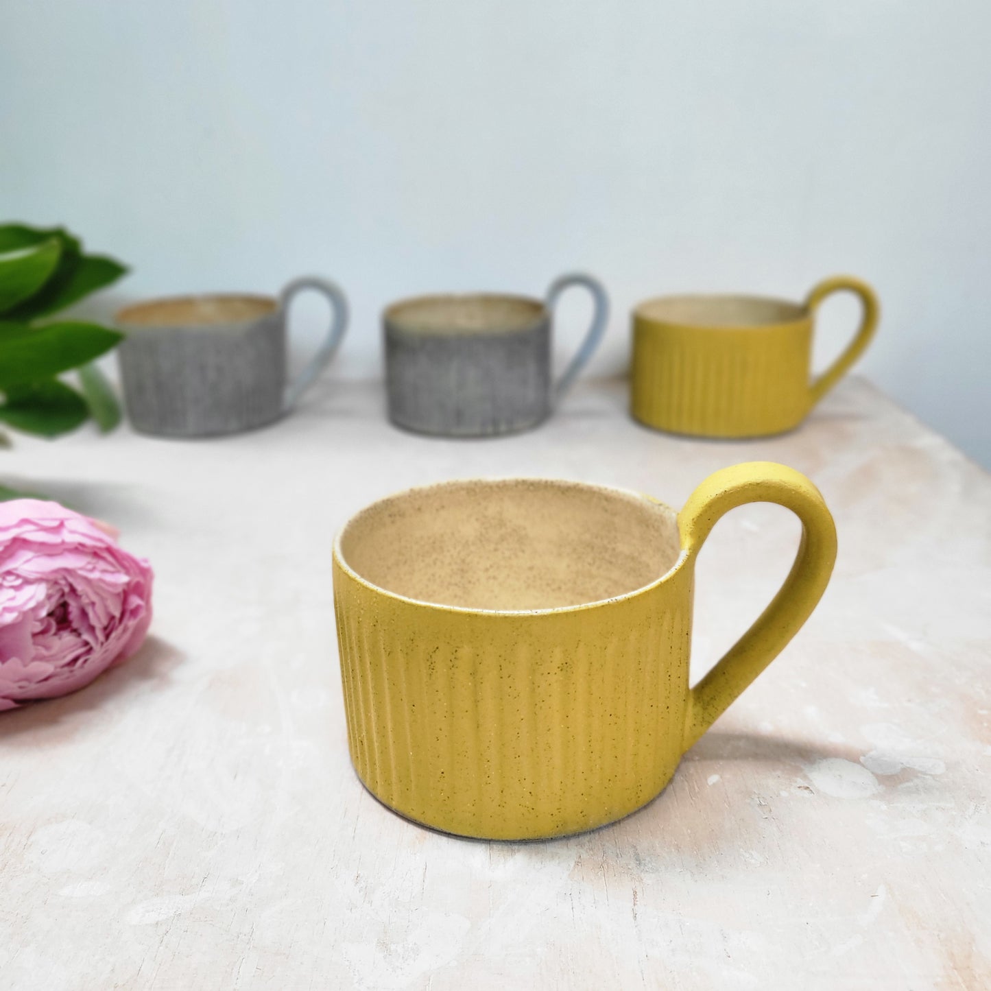Yellow cup with handle