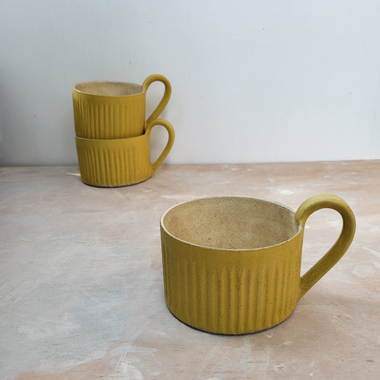 Yellow cup with handle